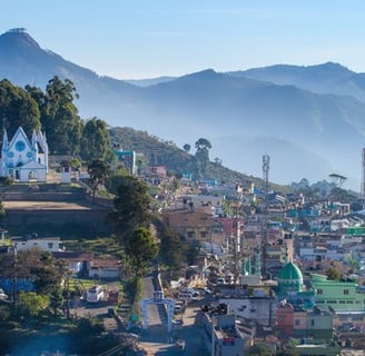 Beautiful houses in the mountain ranges covering with mist