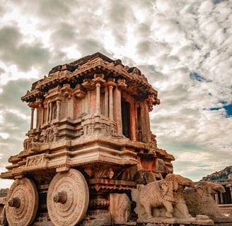 The chariot rests on two massive wheels, pulled by elephants further emphasizing its unique design.