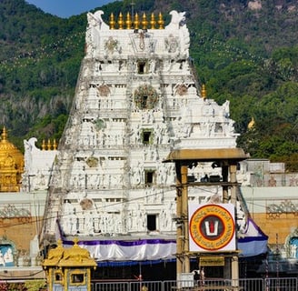 A temple shrine with white and golden color paint