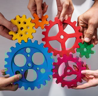 a group of people holding colorful gearswheels