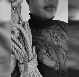 Dominatrix offering rope to viewer – beginner rope training and bondage in London