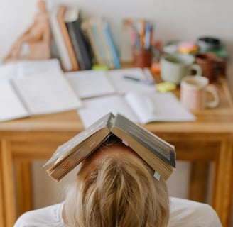 a woman with a book on her head and a book on her head