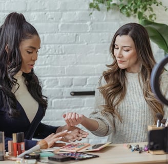 a woman in a white sweater and a woman in a blue sweater