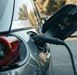 a car is shown with a charging station attached to it