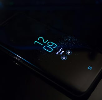 a cell phone with a glowing blue screen