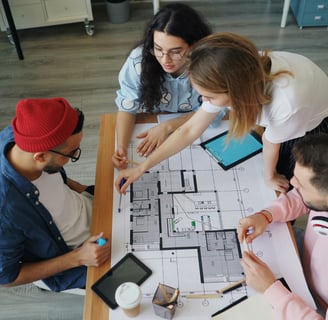 a group of people sitting around a table