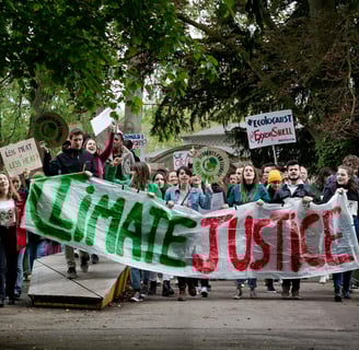 a group of people holding signs and holding signs