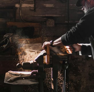 a woodworker cutting wood