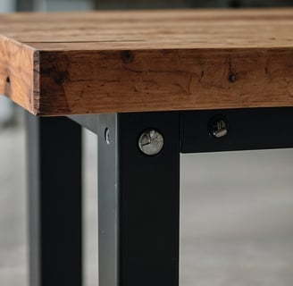 a wooden workbench with metal legs