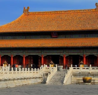 a building with a statue of a lion head on the side of it, China, Beijing,