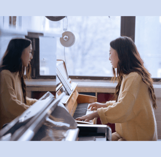 Young Asian woman practicing piano