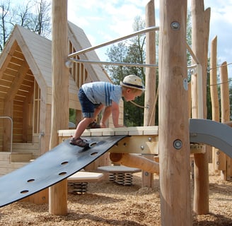 Earthscapes Play Structure with boy climbing on it