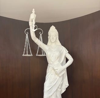 The blindfold of the "goddess of justice" has been removed, instead of the sword in her hand she now holds the Constitution.
