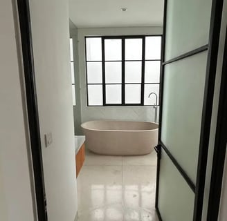terrazzo bathroom in Balinese villa with natural stone and outdoor view