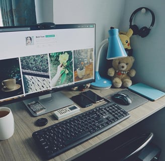 a computer on the table with the website design in the screen