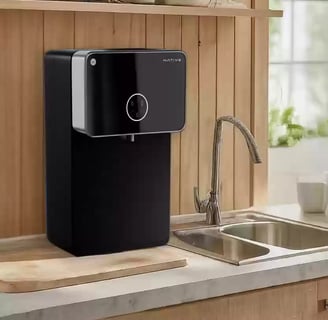 a black and white kitchen with a water purifier