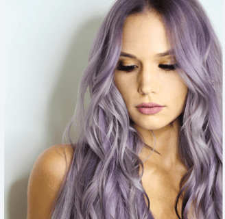 a woman with long hair and purple hair