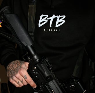 ready for action with my airsoft rifle and black BTB hoody