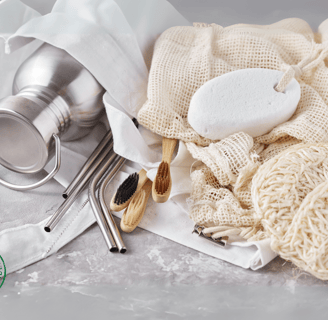 eco-friendly items, including stainless steel straws, bamboo toothbrushes, reusable mesh bags,