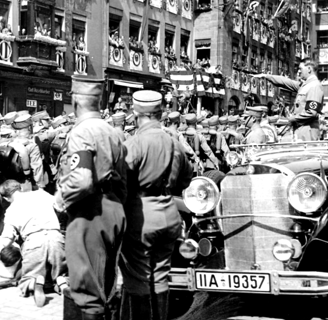 "SA Brownshirts marching past Hitler at the 1935 Nuremberg Rally in Nazi Germany during the height