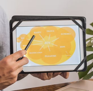 A photo of someone holding an iPad with a diagram on.