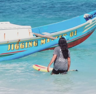 a man and woman are standing in the water