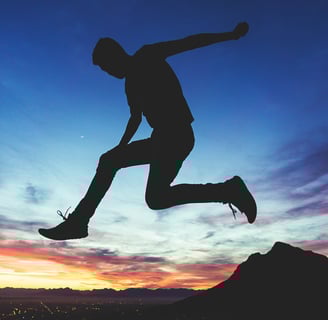man jump sundown sky