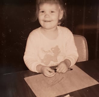 Cindy as a little girl drawing