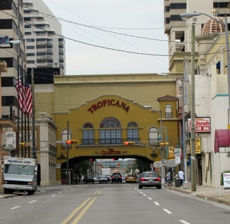 a city street scene with a bus stop sign