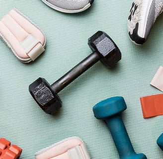 a variety of fitness equipment including dumbs and dumbs