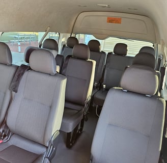 Spacious 14-seater van for group tours and airport shuttle service