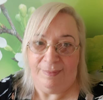 a picture of Kath. She has a kind face, white hair and glasses. She's lovely if I say so myself.