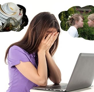Woman in despair in front of computer surrounded by pics of all the other tasks she has to do