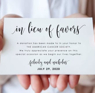 a person holding a wedding donation card