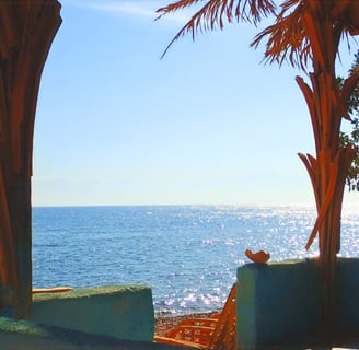 Watching the sea from our popular bungalow with shared bathroom first line