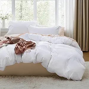 a bed with a blanket on top of it