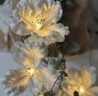 a vase with flowers and a vase with a vase on it