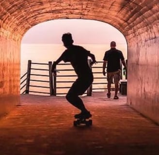 a man skateboarding down a tunnel in a tunnel in tunnel park in holland michigan