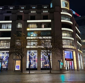 a building with a clock tower in the middle of the street