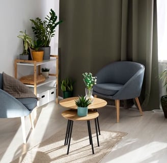a living room with a chair and a table