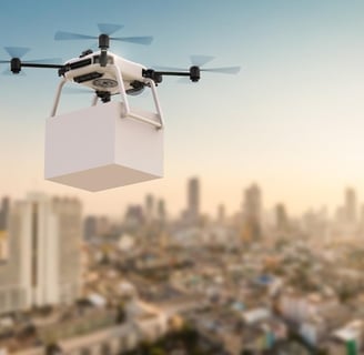 Drone flying over a congested city to demonstrate the concept of clean, emissions-free delivery.