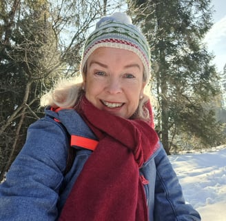 a smiling woman on a snowy day