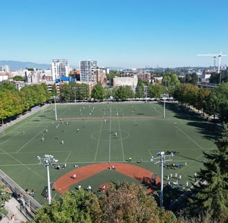 a soccer field with a lot of people playing soccer