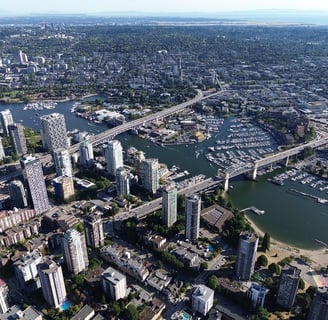 a cityscape of a large city with a bridge and a river
