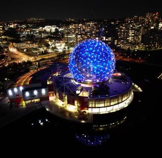 a large blue ball in the middle of a city