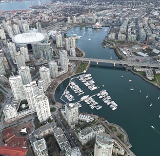 a cityscape of a city with a bridge and boats