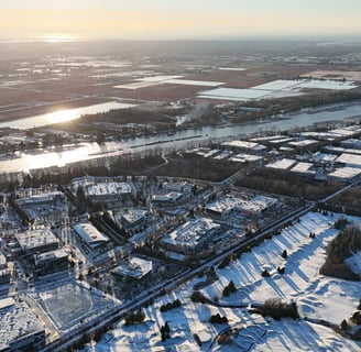 a cityscape of a city with a river and a bridge