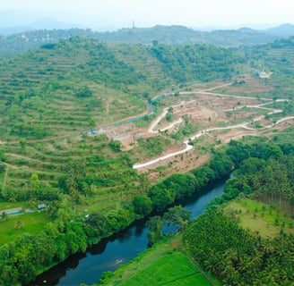 a river with rocks and rocks in the foreground