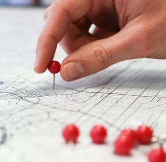 pin being placed on a map