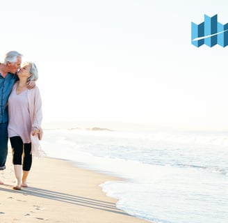 Retired couple enjoying a walk on a white sand beach in Zambales, promoting a peaceful retirement li